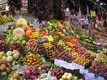 Display of fruits and vegetables at a market stand.